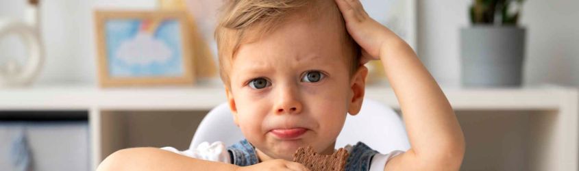 young kid playing with fidget