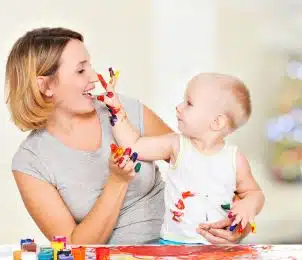 preview happy child draws face her nanny